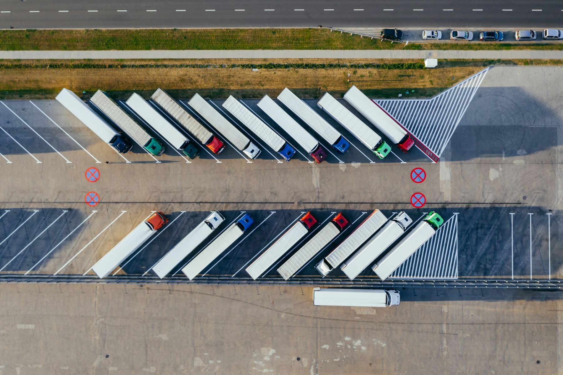 Aerial view of vehicles parked in rows
